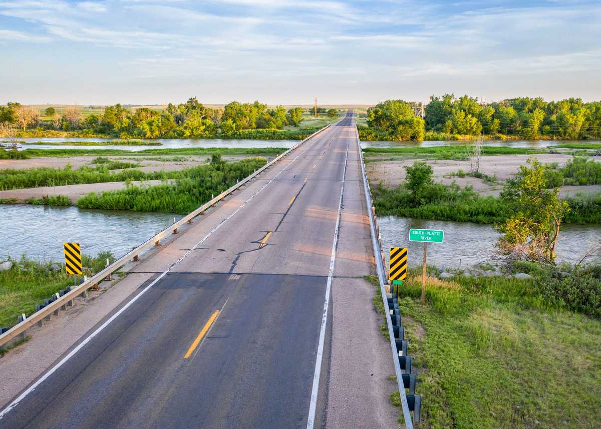 highway and bridge over the South Platte River in Nebraska at Brule, aerial view with summer scenery