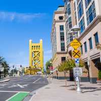 Urban landscape in downtown Sacramento; the Tower Bridge visible in the background; California