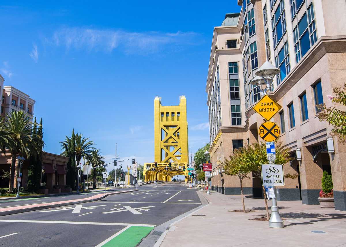 Urban landscape in downtown Sacramento; the Tower Bridge visible in the background; California