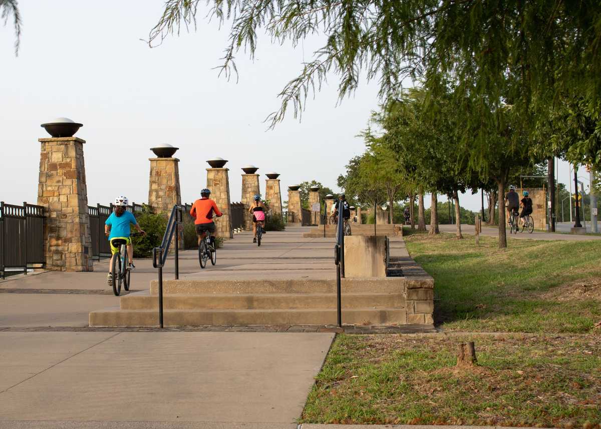 Dallas, TX / USA - August 20, 2020: People ridding bike in the White Rock Lake in summer