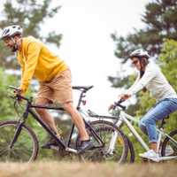 Happy couple on a bike ride in the countryside