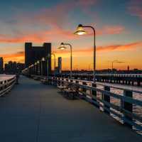 Sunset over Pier 34 and Jersey City, in Manhattan, New York City