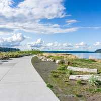 Billowing clouds hover over the Puget Sound and Dune Peninsula Park in Tacoma, Washington.